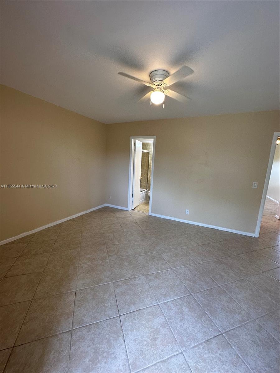 538 Mansfield M, Unit 538 Boca Raton, FL 33434 - Photo 9 of 13 a view of an empty room with a window
