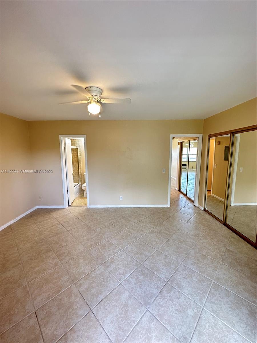 538 Mansfield M, Unit 538 Boca Raton, FL 33434 - Photo 10 of 13 a view of an empty room with a window