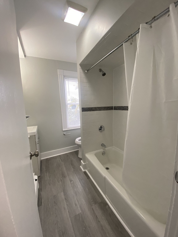 2 Swetts Court Watertown, MA 02472 - Photo 15 of 17 a bathroom with a bathtub and a shower