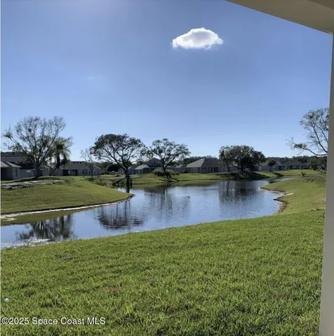 a view of a lake with a big yard