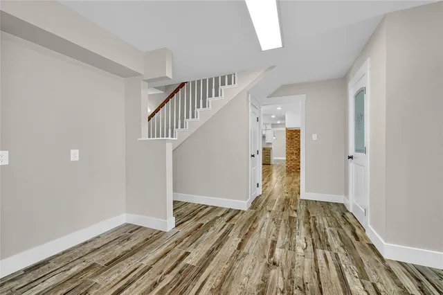 a view of entryway with wooden floor