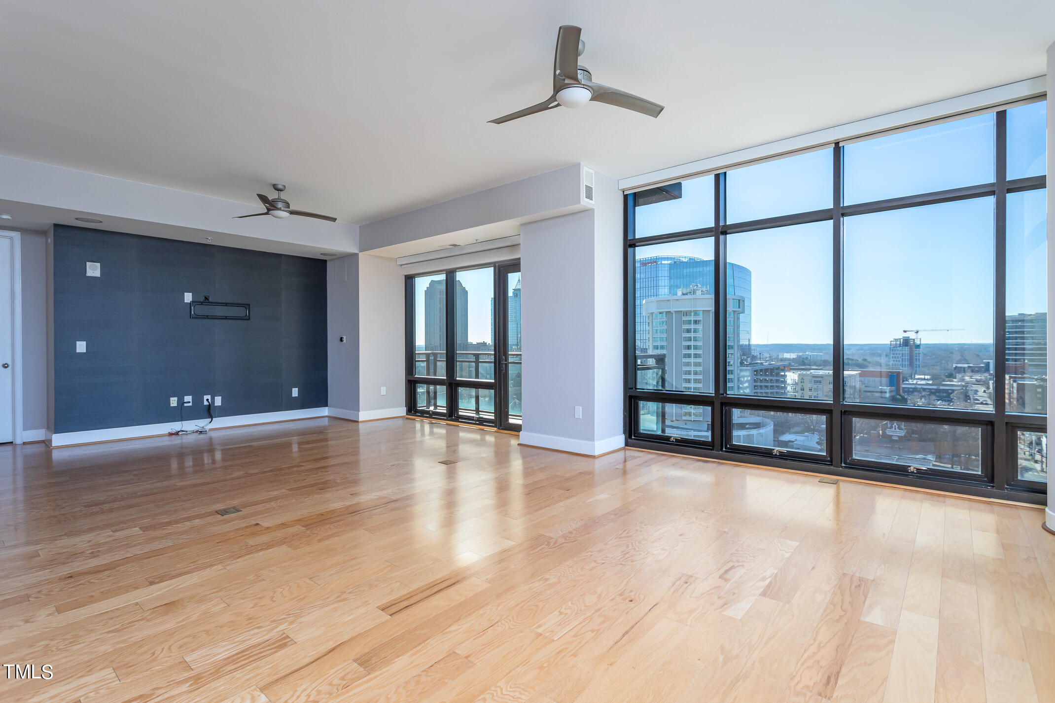 122 North Harrington Street, Unit 1075 Raleigh, NC 27603 - Photo 13 of 38 a view of an empty room with glass door