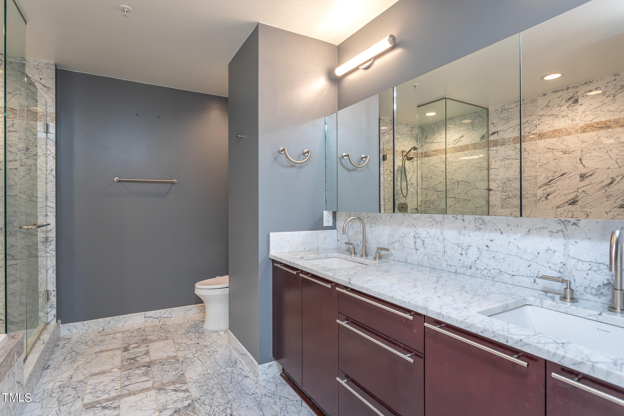 122 North Harrington Street, Unit 1075 Raleigh, NC 27603 - Photo 16 of 38 a bathroom with a granite countertop sink and a mirror