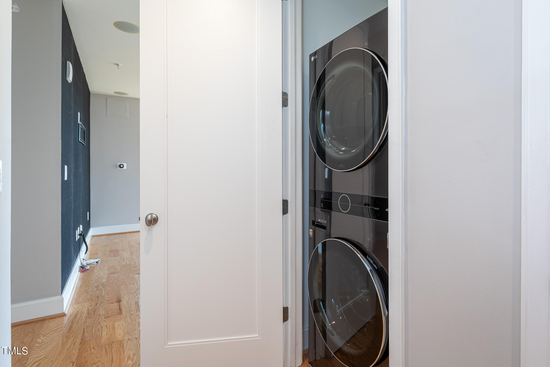 122 North Harrington Street, Unit 1075 Raleigh, NC 27603 - Photo 21 of 38 a close view of a utility room with washer and dryer