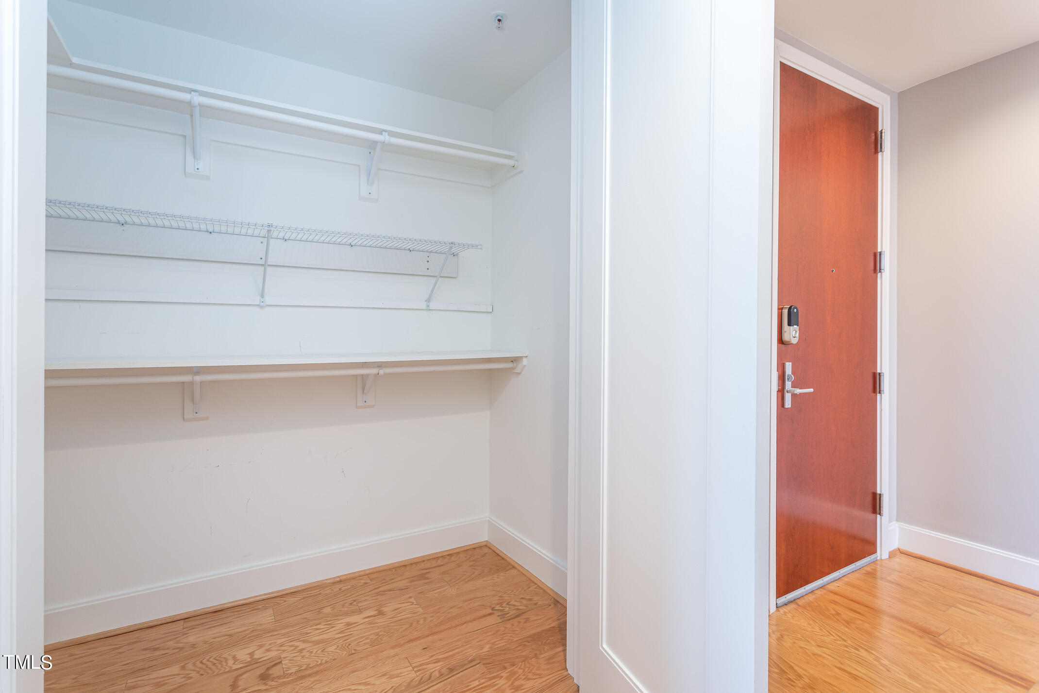 122 North Harrington Street, Unit 1075 Raleigh, NC 27603 - Photo 25 of 38 a view of a room with rack on the wall