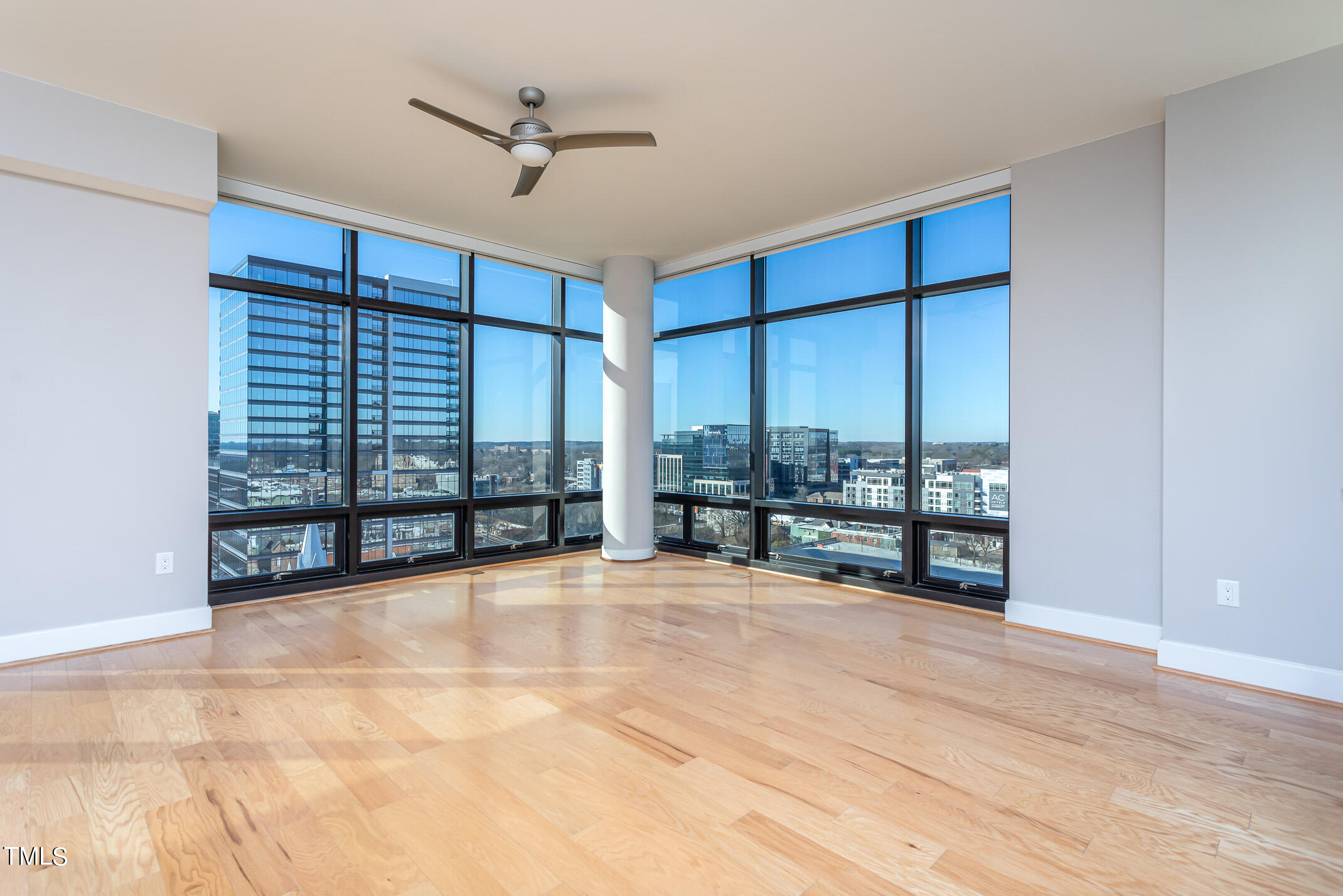 122 North Harrington Street, Unit 1075 Raleigh, NC 27603 - Photo 3 of 38 a view of an empty room with a balcony