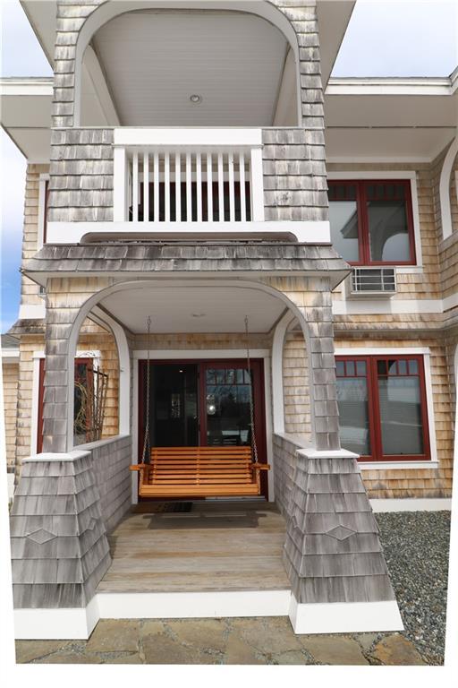 60 Ellsworth Road, Unit 1 Blue Hill, ME 04614 - Photo 21 of 25 First floor covered porch with swing...