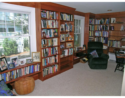 181 Nehoiden Road Newton, MA 02468 - Photo 12 of 24 a living room with furniture and a book shelf