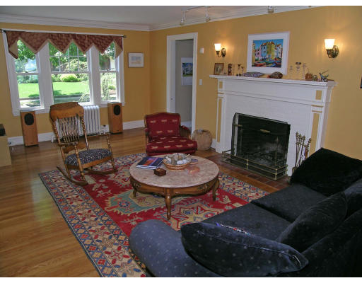 181 Nehoiden Road Newton, MA 02468 - Photo 2 of 24 a living room with furniture a fireplace and a large window