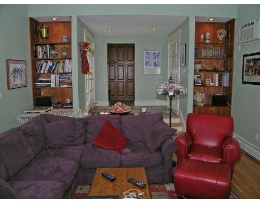 181 Nehoiden Road Newton, MA 02468 - Photo 4 of 24 a living room with furniture and a book shelf