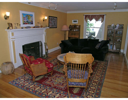181 Nehoiden Road Newton, MA 02468 - Photo 8 of 24 a living room with furniture a window and a fireplace
