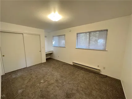 a view of an empty room with a window
