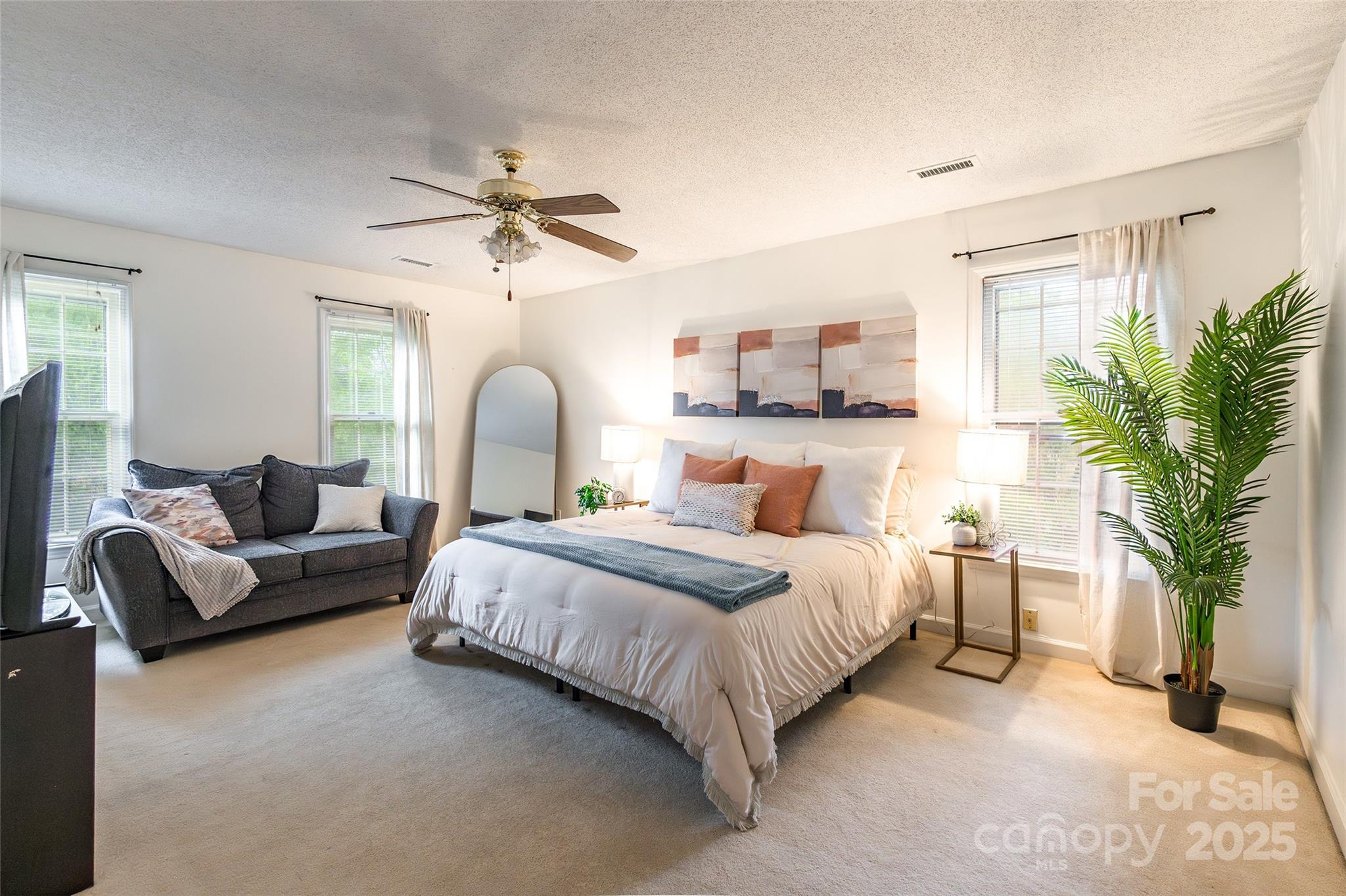 6816 Porterfield Road Charlotte, NC 28226 - Photo 15 of 31 a bedroom with bed and a chandelier