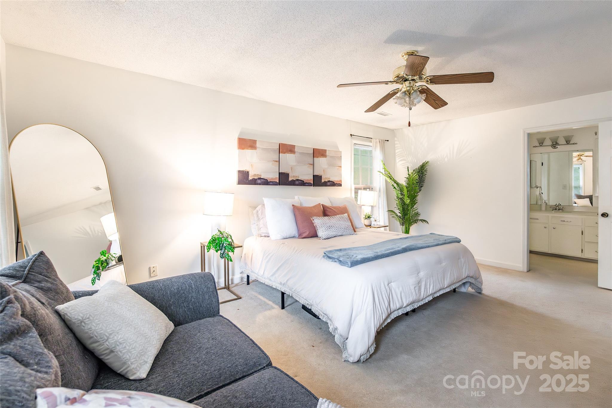 6816 Porterfield Road Charlotte, NC 28226 - Photo 16 of 31 a bedroom with a bed and ceiling fan