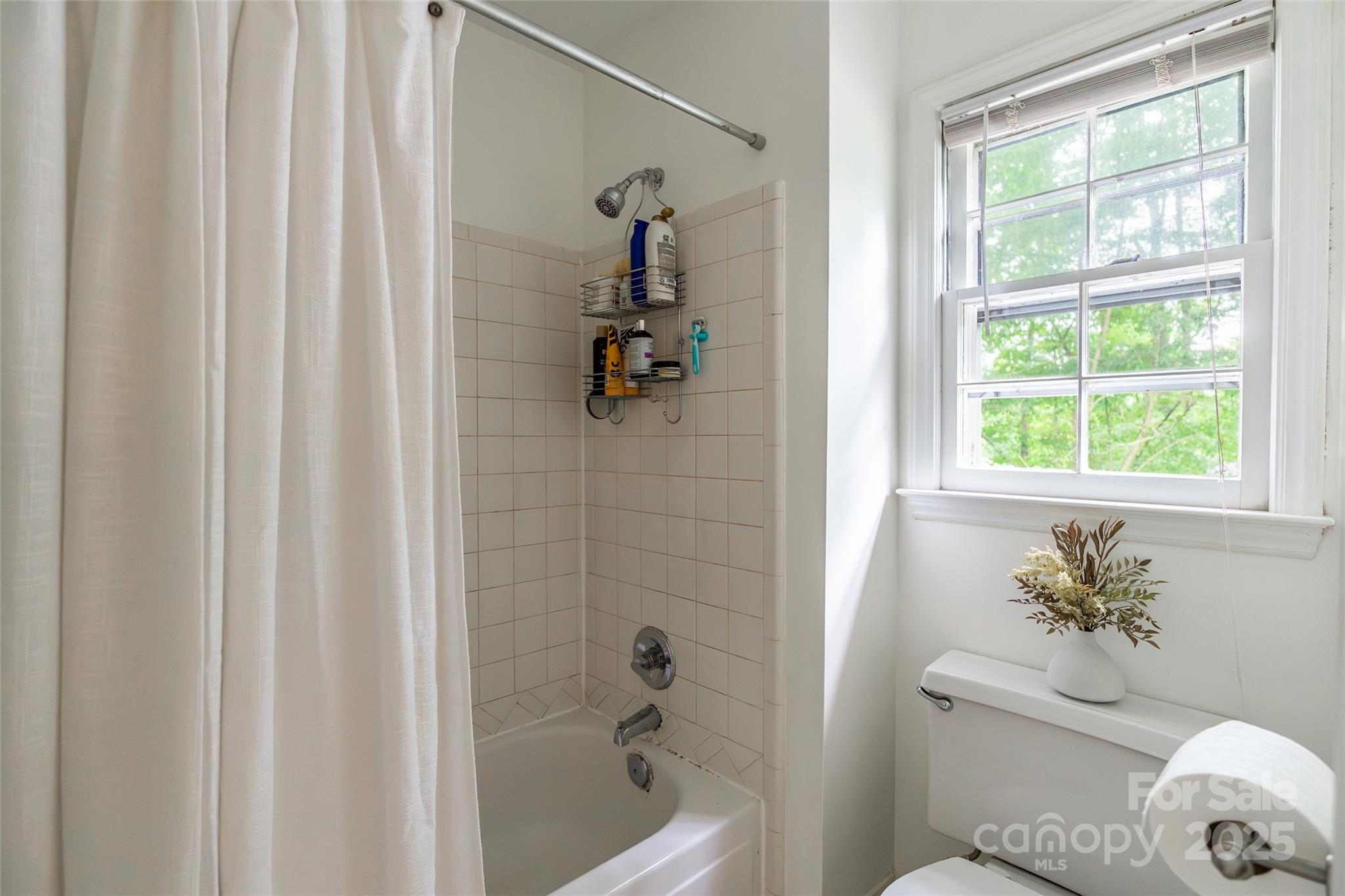 6816 Porterfield Road Charlotte, NC 28226 - Photo 18 of 31 a bath room with a toilet and a shower
