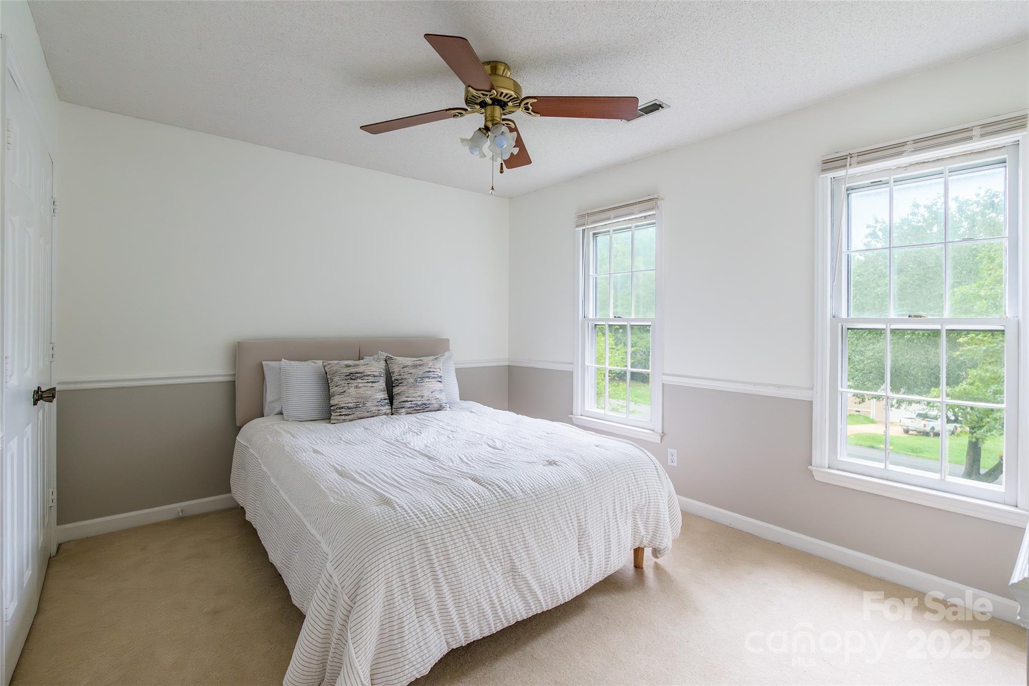 6816 Porterfield Road Charlotte, NC 28226 - Photo 19 of 31 a bedroom with a bed and window