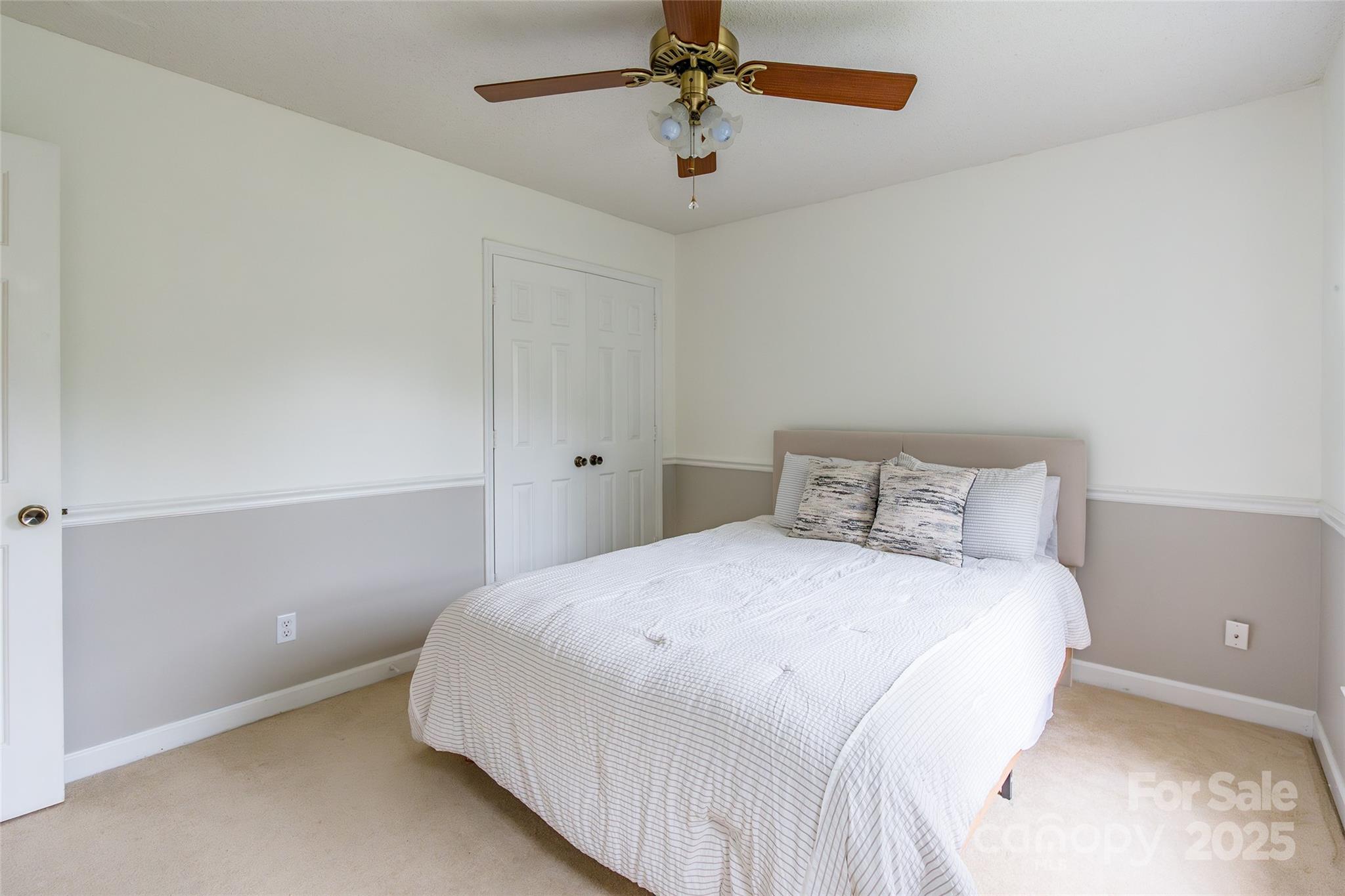 6816 Porterfield Road Charlotte, NC 28226 - Photo 20 of 31 a bedroom with a bed and window