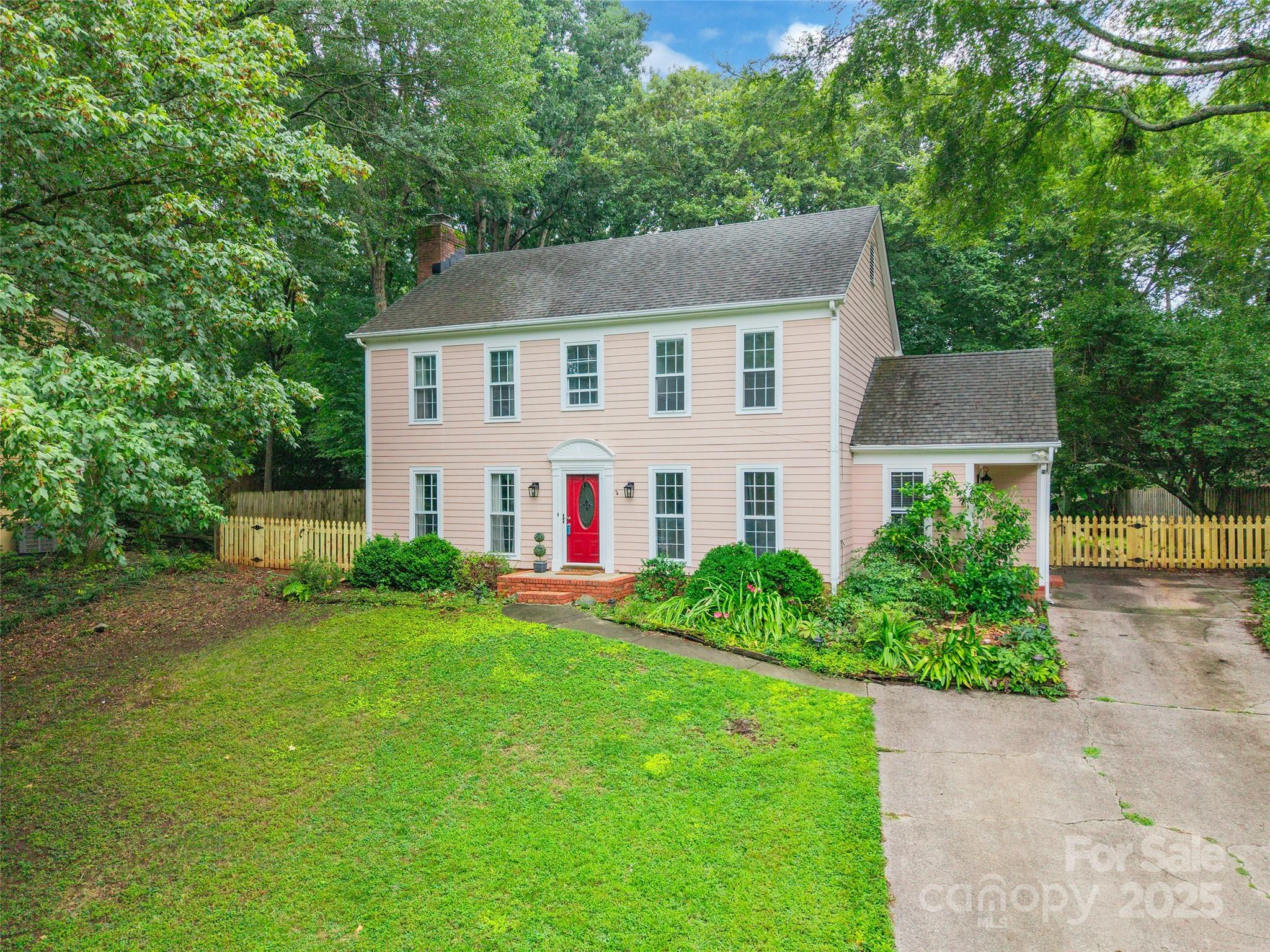 6816 Porterfield Road Charlotte, NC 28226 - Photo 2 of 31 a view of a house with backyard and garden