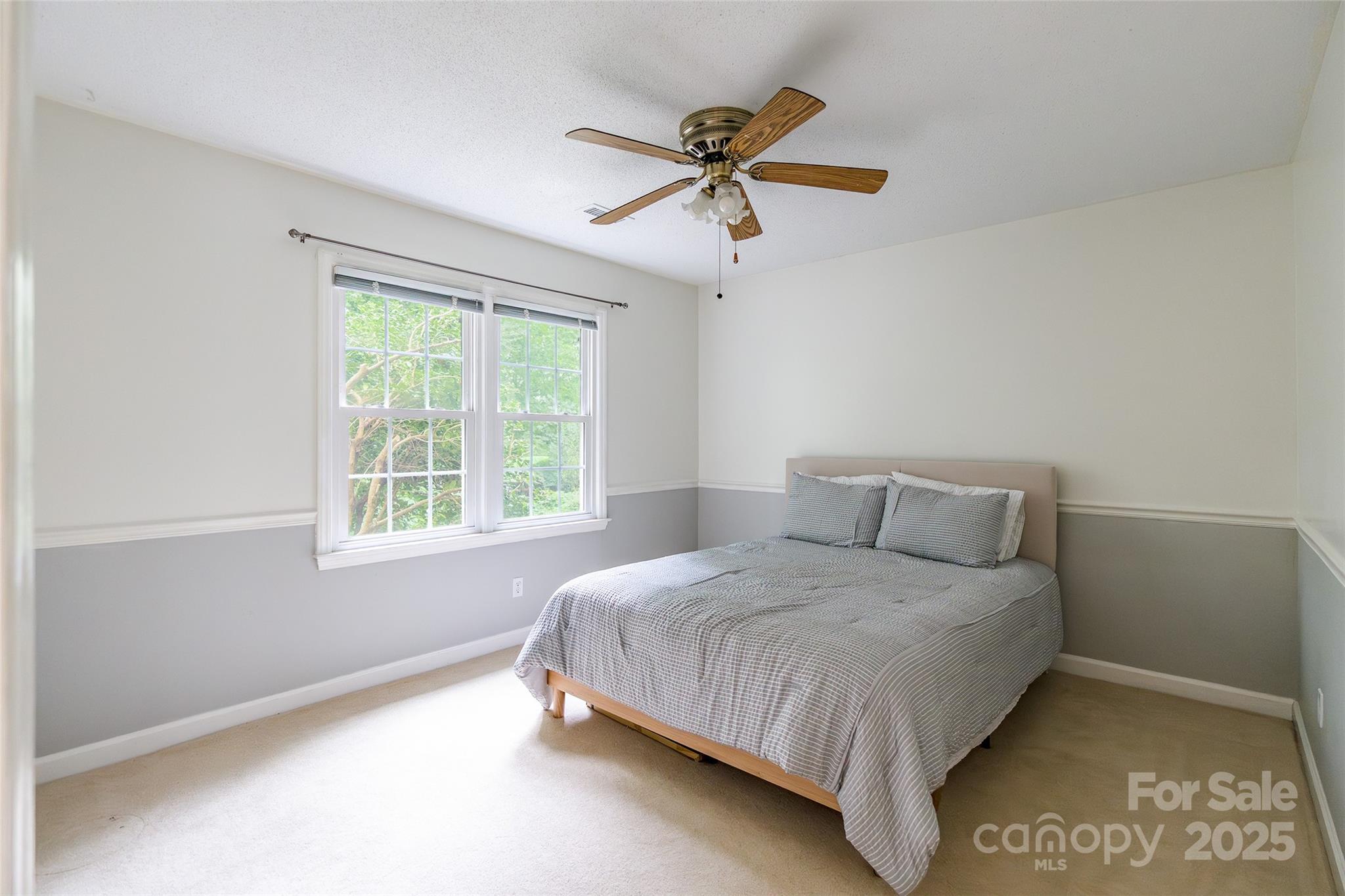 6816 Porterfield Road Charlotte, NC 28226 - Photo 21 of 31 a bedroom with a bed and a window