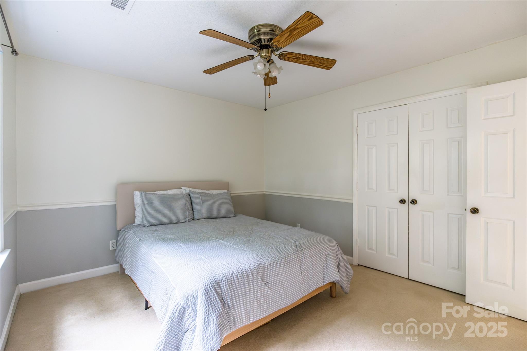 6816 Porterfield Road Charlotte, NC 28226 - Photo 22 of 31 a bedroom with a bed and window