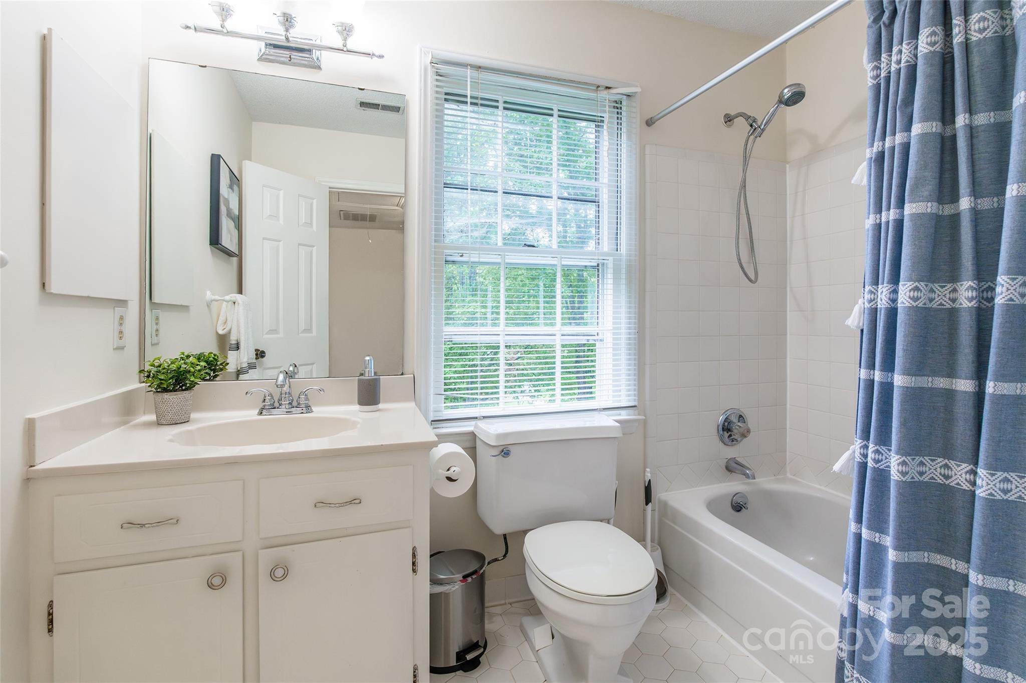 6816 Porterfield Road Charlotte, NC 28226 - Photo 23 of 31 a bathroom with a sink toilet and shower