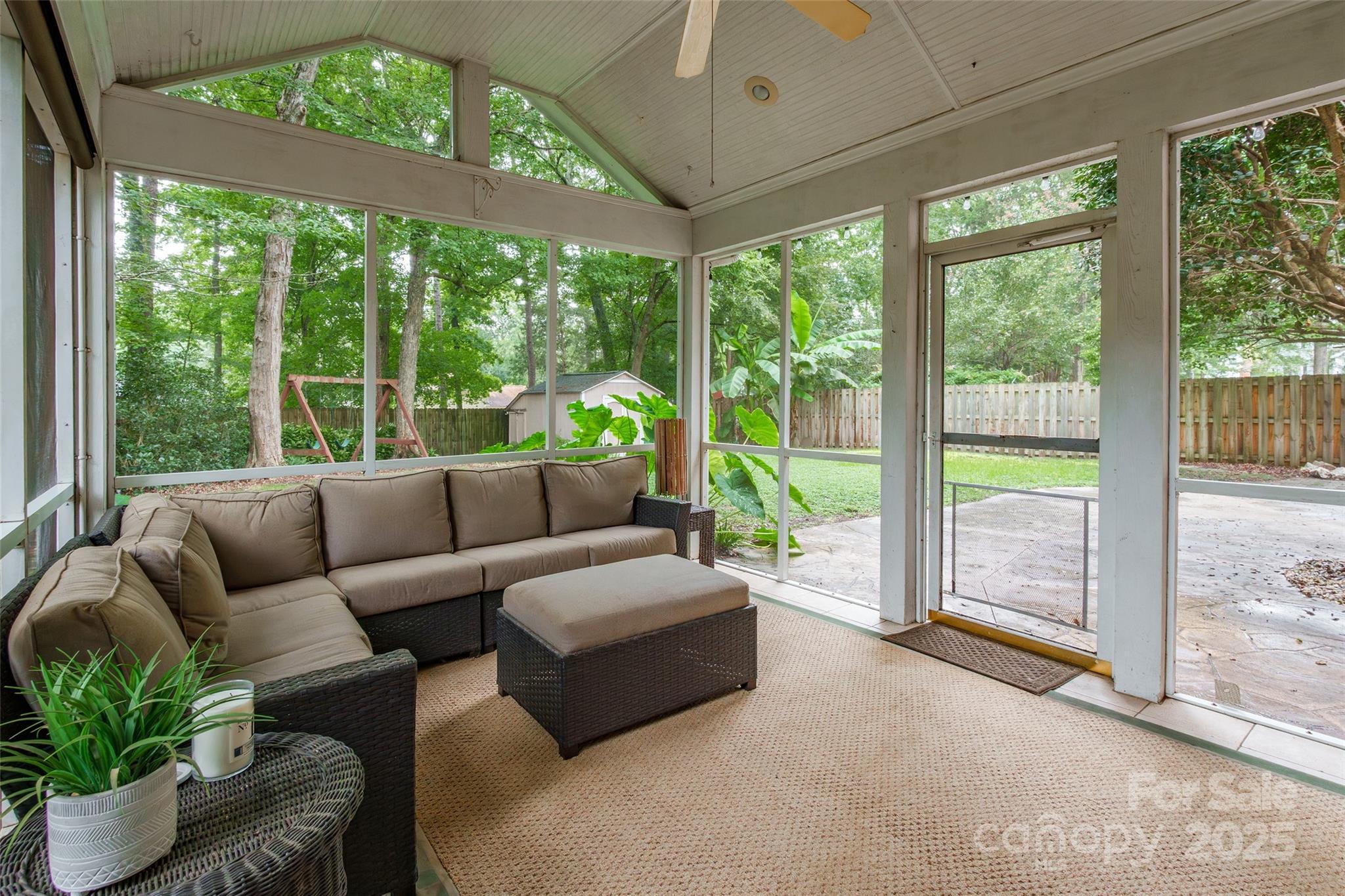 6816 Porterfield Road Charlotte, NC 28226 - Photo 25 of 31 a living room with furniture and a floor to ceiling window