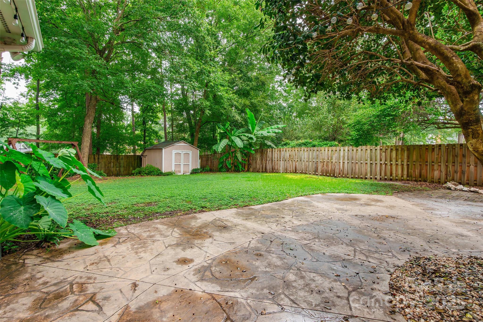6816 Porterfield Road Charlotte, NC 28226 - Photo 26 of 31 a view of a house with a yard