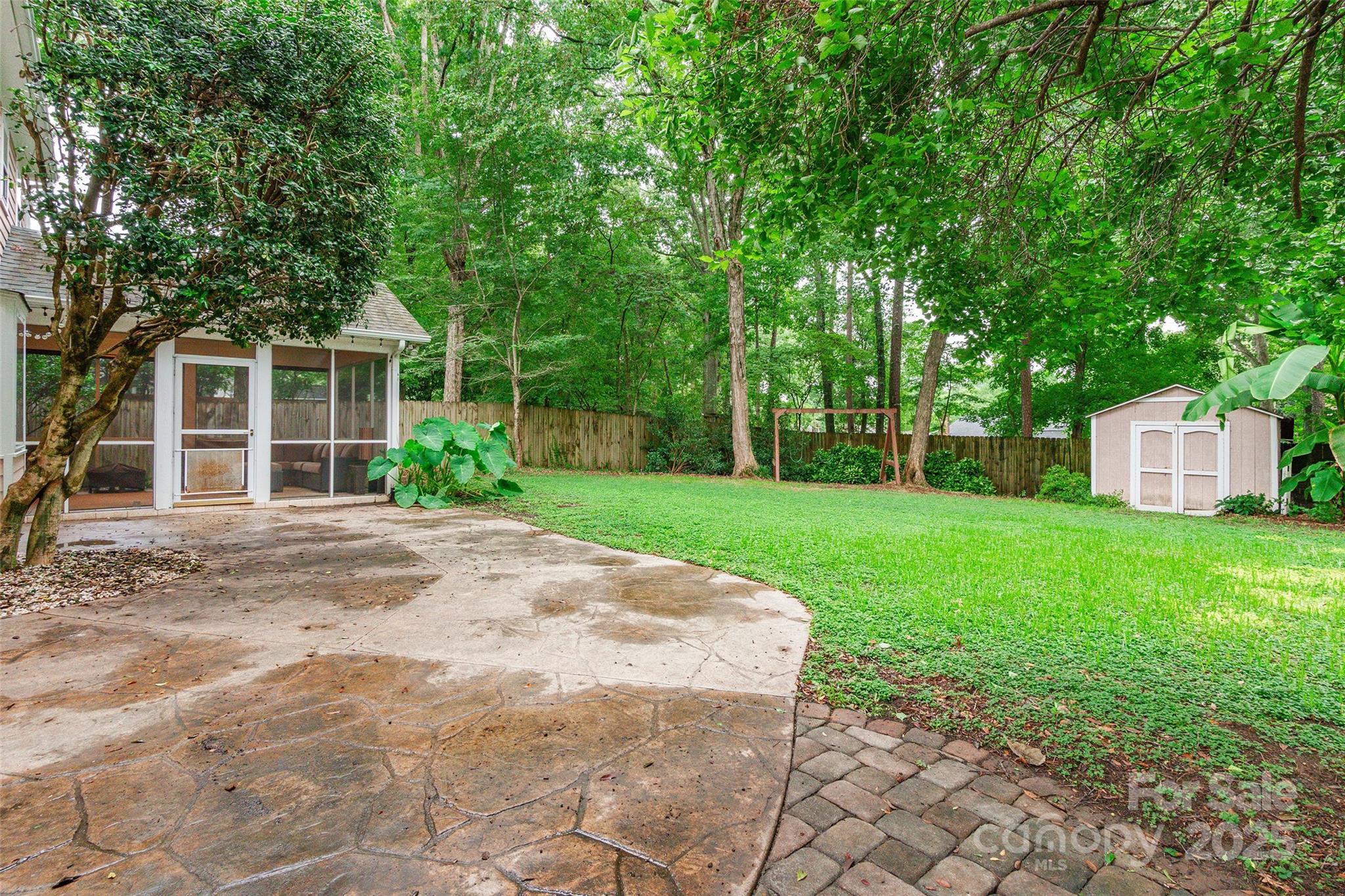 6816 Porterfield Road Charlotte, NC 28226 - Photo 27 of 31 a view of a house with yard and a garden