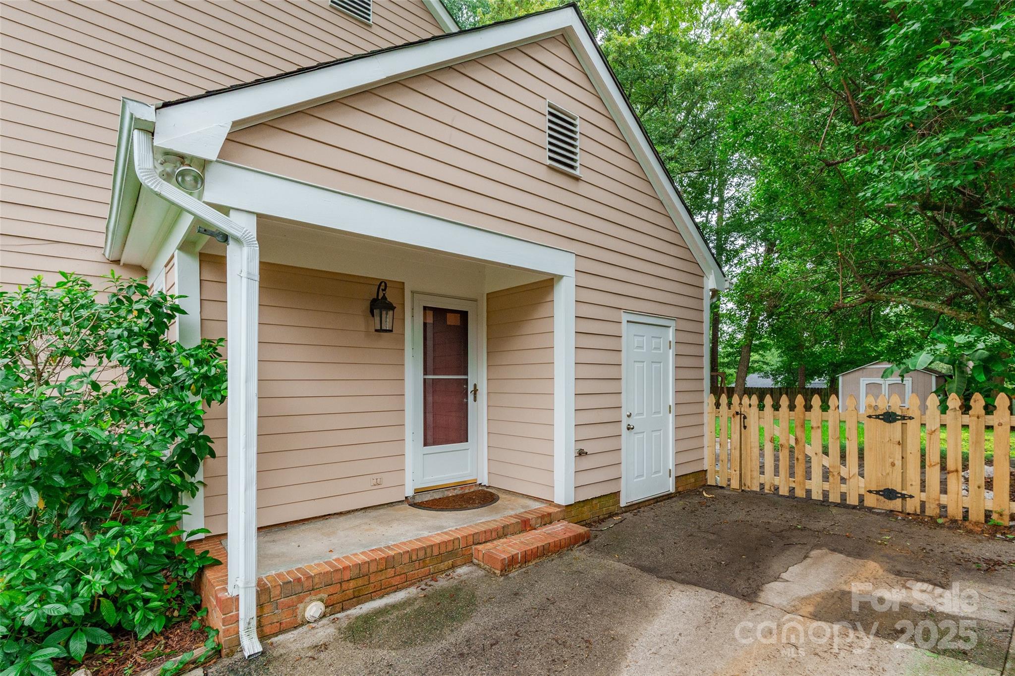 6816 Porterfield Road Charlotte, NC 28226 - Photo 28 of 31 a view of a house with a yard