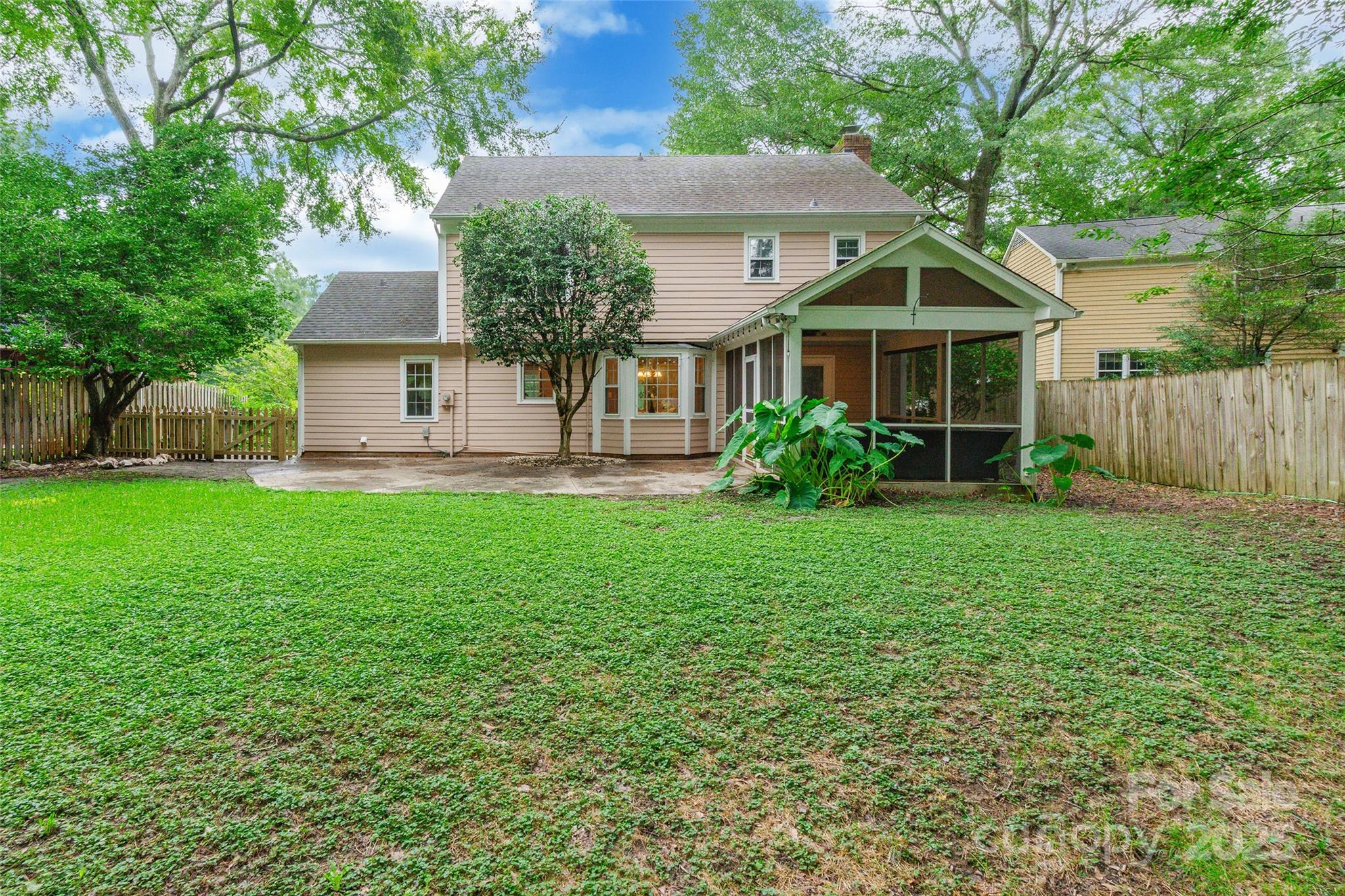 6816 Porterfield Road Charlotte, NC 28226 - Photo 29 of 31 a front view of a house with a yard and trees
