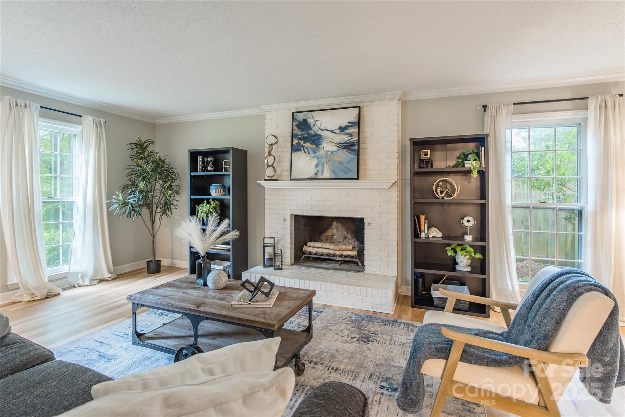 6816 Porterfield Road Charlotte, NC 28226 - Photo 6 of 31 a living room with furniture a table and a fireplace