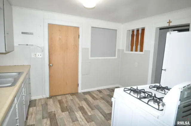 a bedroom with a bed and a sink