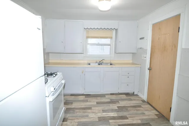 a bathroom with a sink a toilet and a bathtub