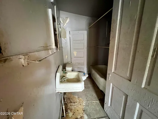 a bathroom with a bathtub and shower