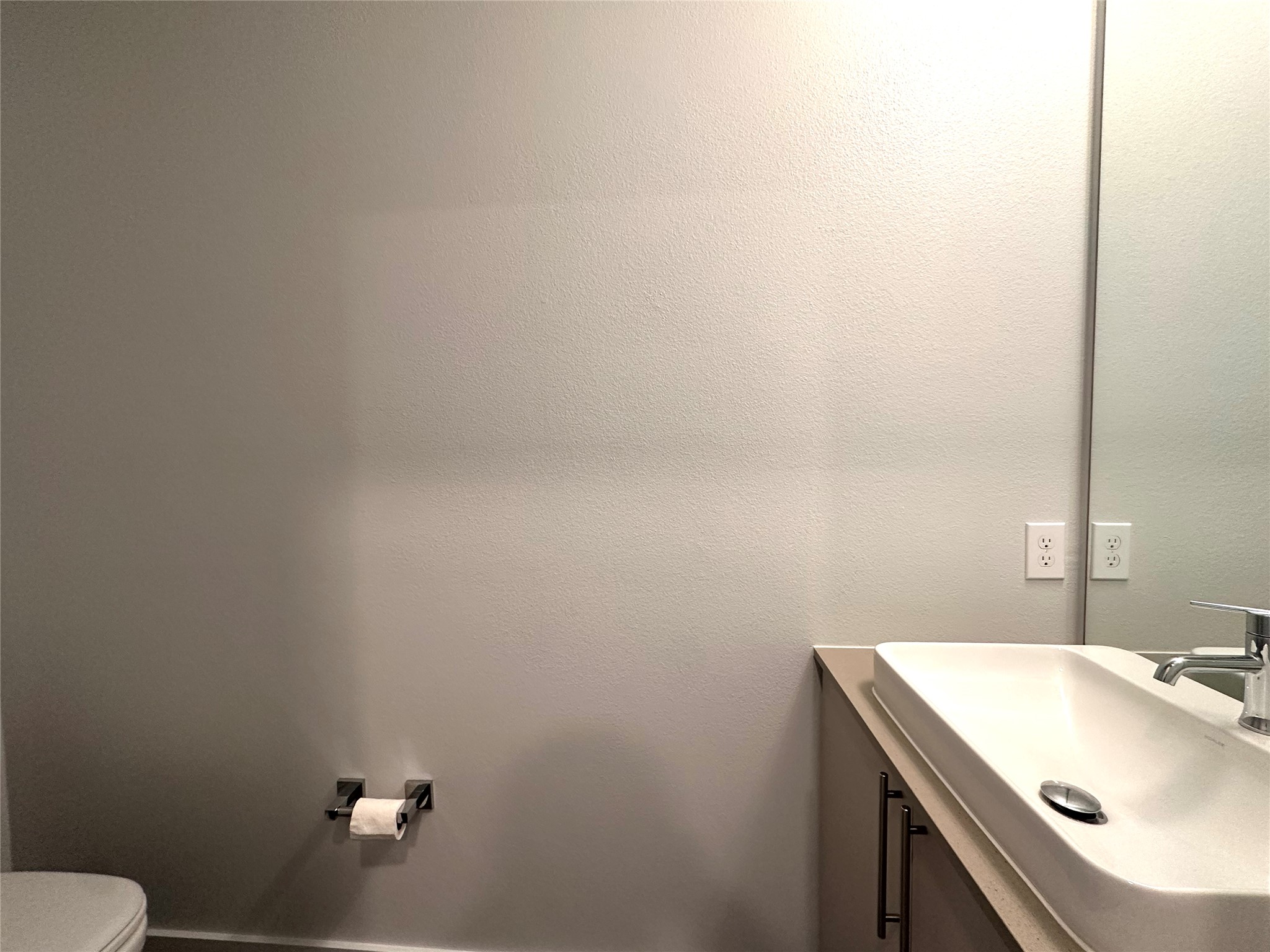 4004 Banister Lane, Unit 312 Austin, TX 78704 - Photo 15 of 27 Half bathroom with vanity and toilet