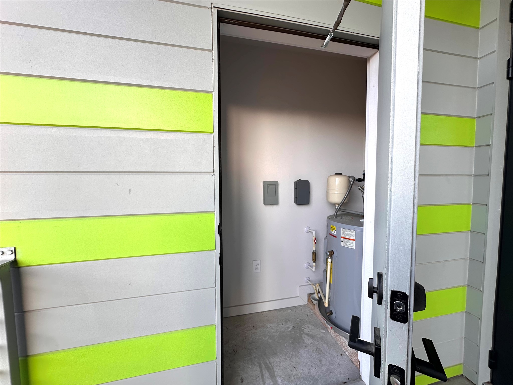 4004 Banister Lane, Unit 312 Austin, TX 78704 - Photo 26 of 27 Utility room with water heater