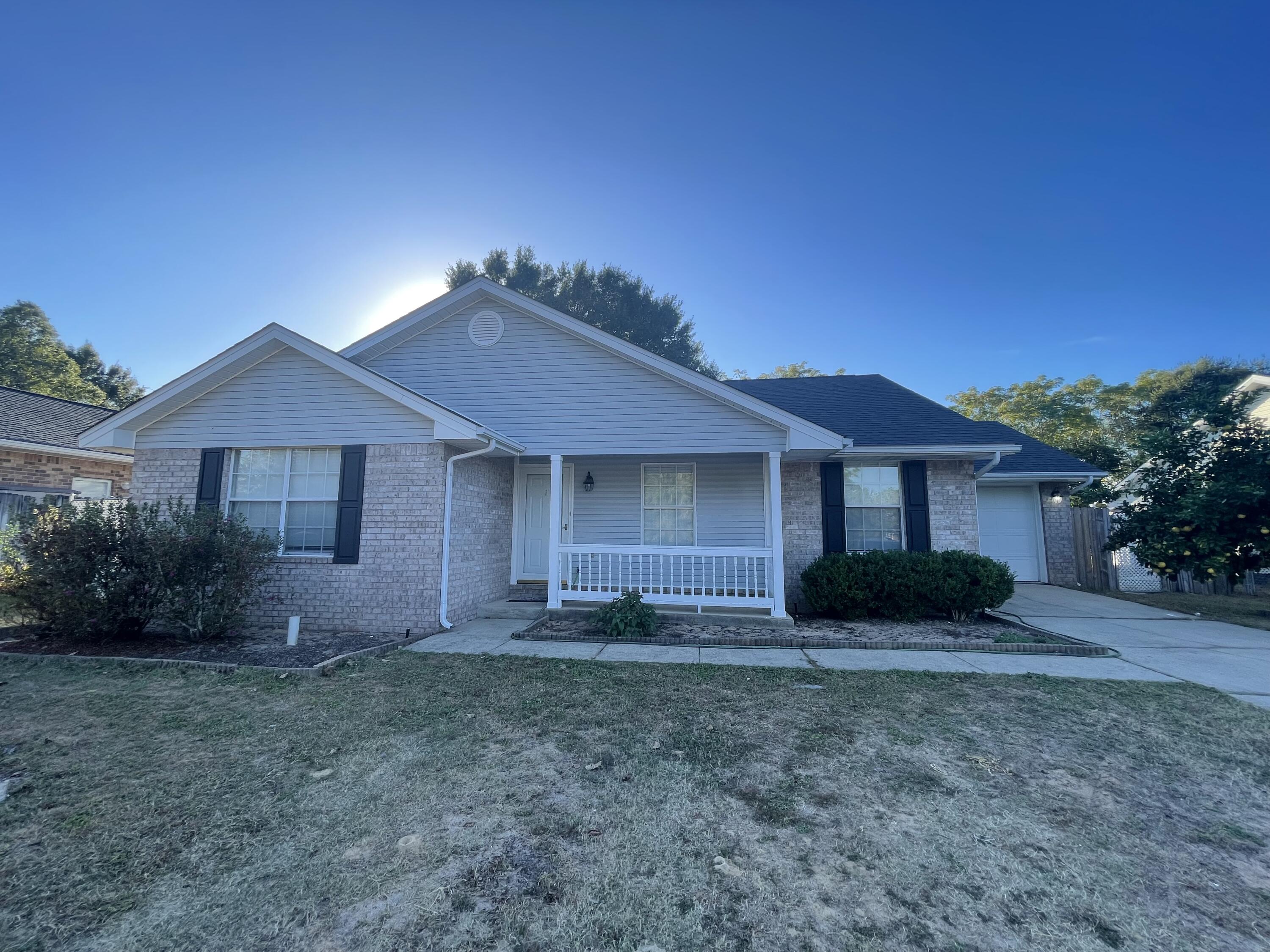 105 Steeplechase Drive Crestview, FL 32539 - Photo 1 of 14 a front view of a house with a yard