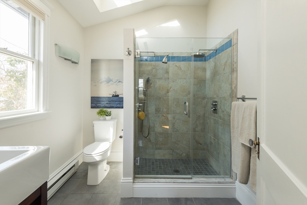 33 Ottawa Road Arlington, MA 02476 - Photo 16 of 38 a bathroom with a shower a toilet and a shower