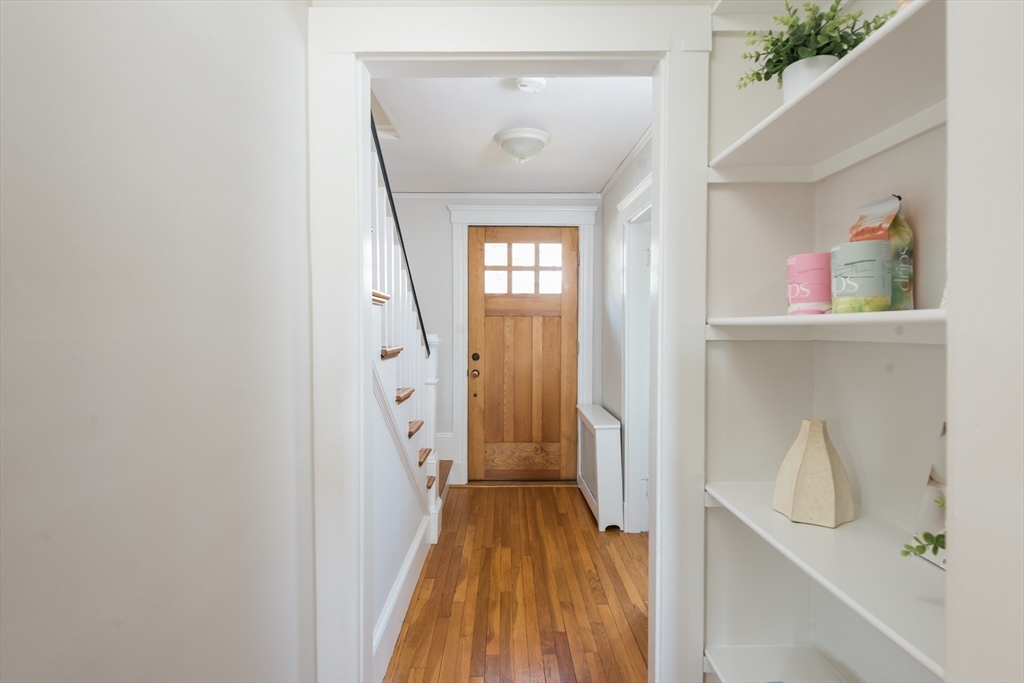 33 Ottawa Road Arlington, MA 02476 - Photo 17 of 38 a view of a hallway with wooden floor and entryway