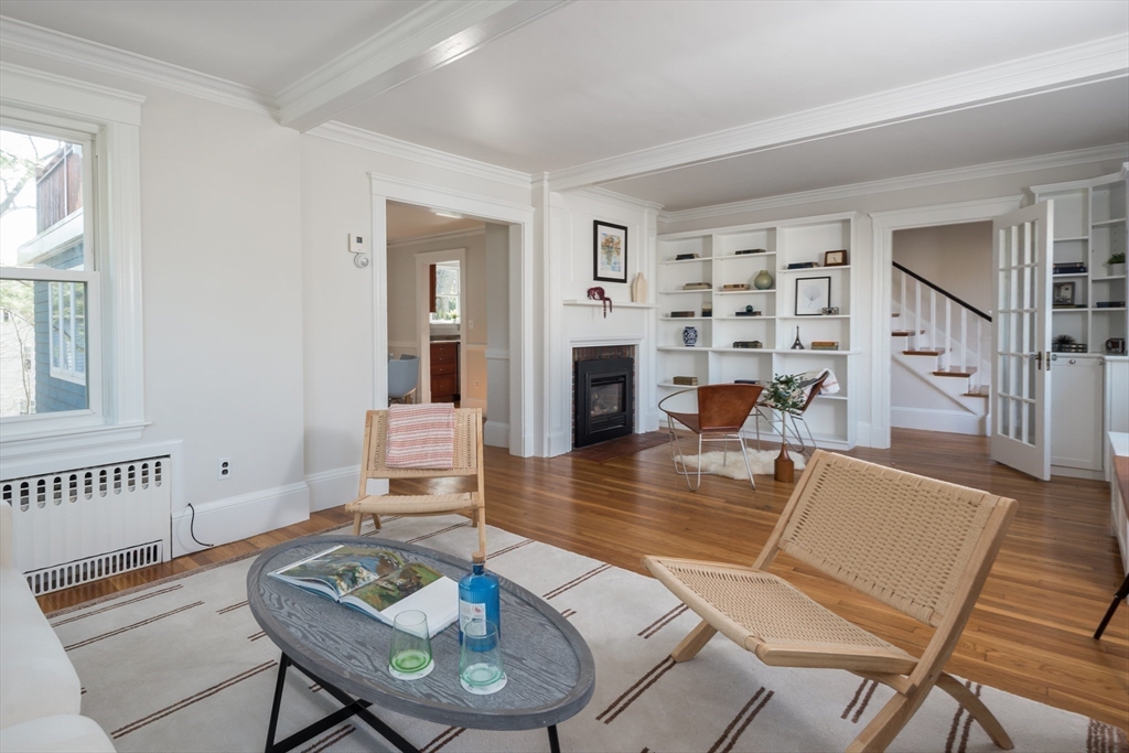 33 Ottawa Road Arlington, MA 02476 - Photo 19 of 38 a living room with furniture and a wooden floor