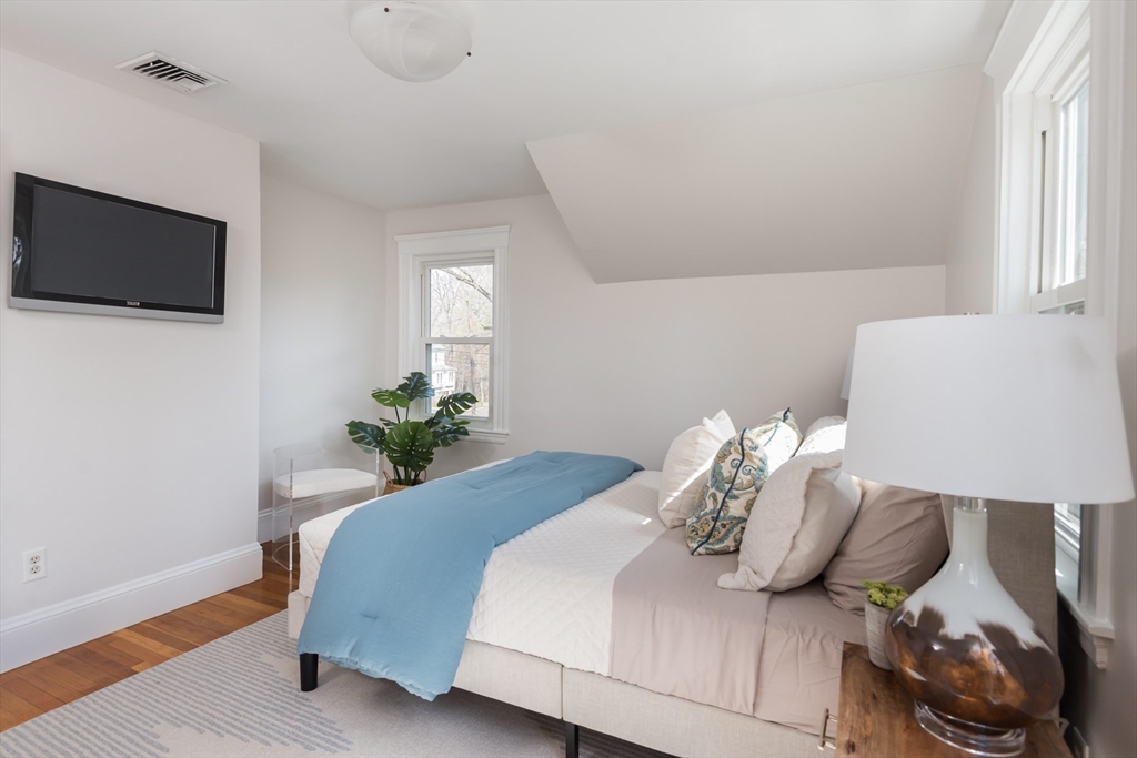 33 Ottawa Road Arlington, MA 02476 - Photo 22 of 38 a bed room with a bed a television and a window
