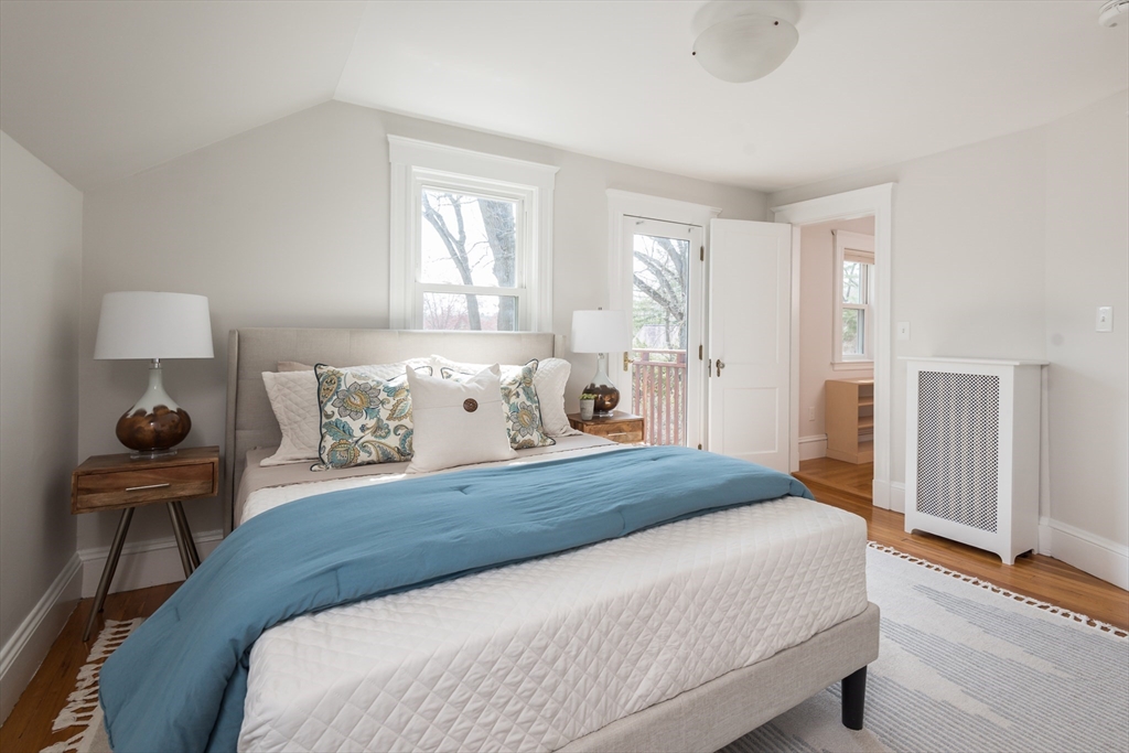 33 Ottawa Road Arlington, MA 02476 - Photo 23 of 38 a bedroom with a bed and a chair in it