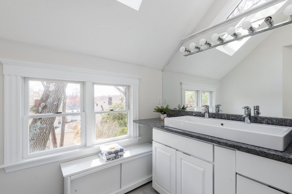 33 Ottawa Road Arlington, MA 02476 - Photo 29 of 38 a bathroom with a sink double vanity and a window