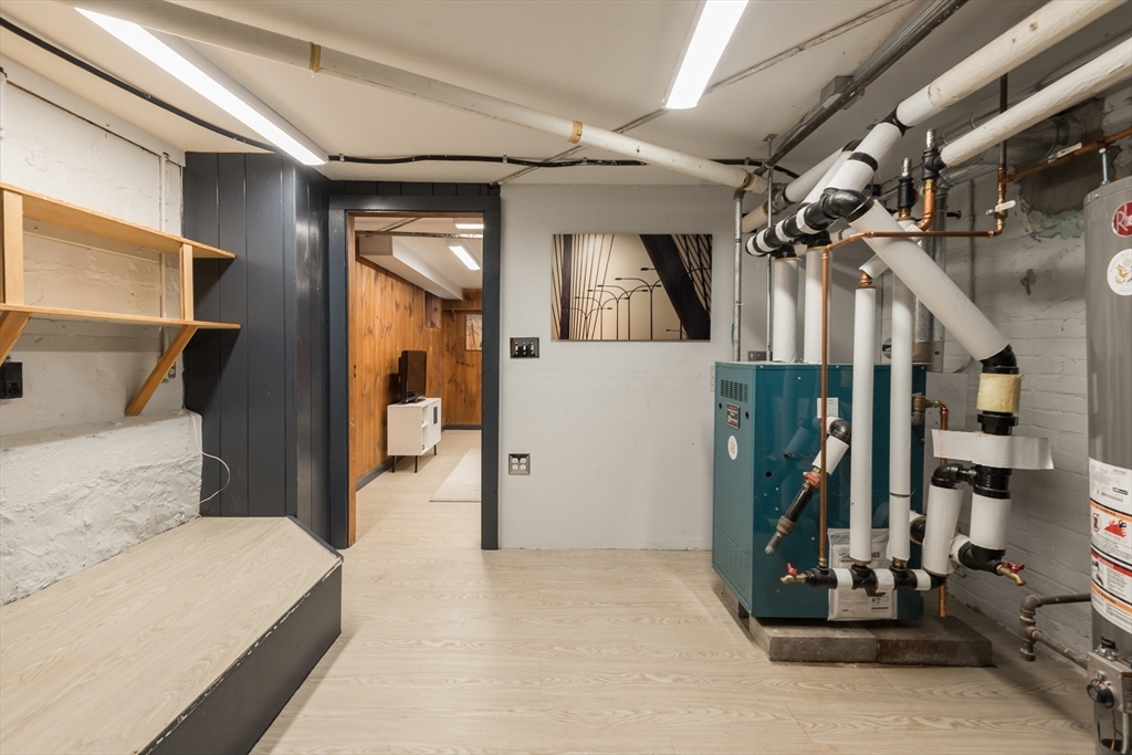 33 Ottawa Road Arlington, MA 02476 - Photo 31 of 38 a bedroom with a large bed and a large mirror on the dresser