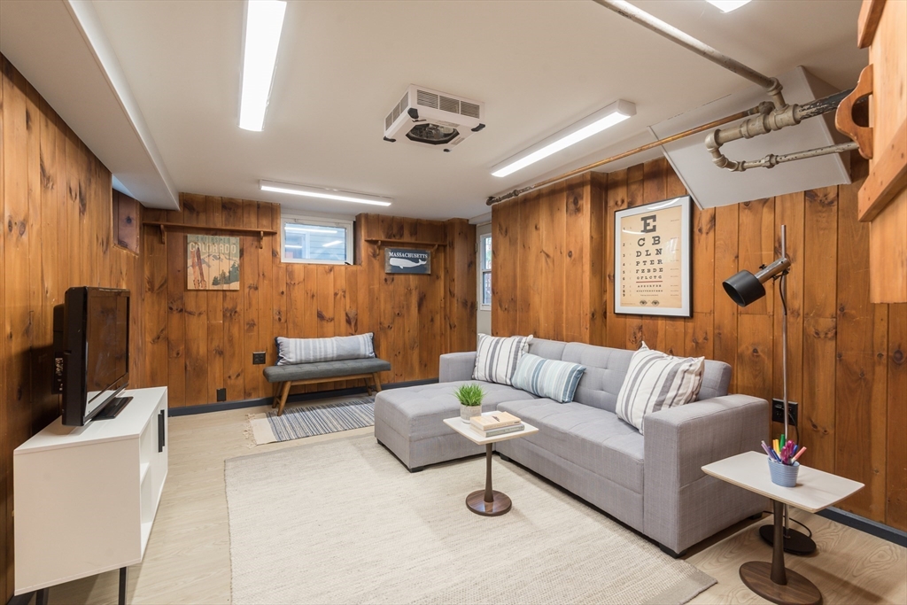 33 Ottawa Road Arlington, MA 02476 - Photo 32 of 38 a living room with furniture and a large window