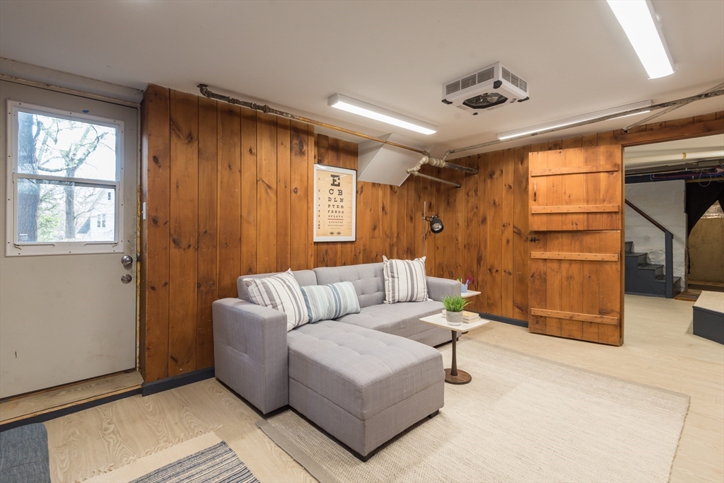 33 Ottawa Road Arlington, MA 02476 - Photo 33 of 38 a living room with furniture and a window