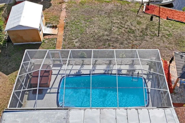 a view of a ocean with boats in front of house