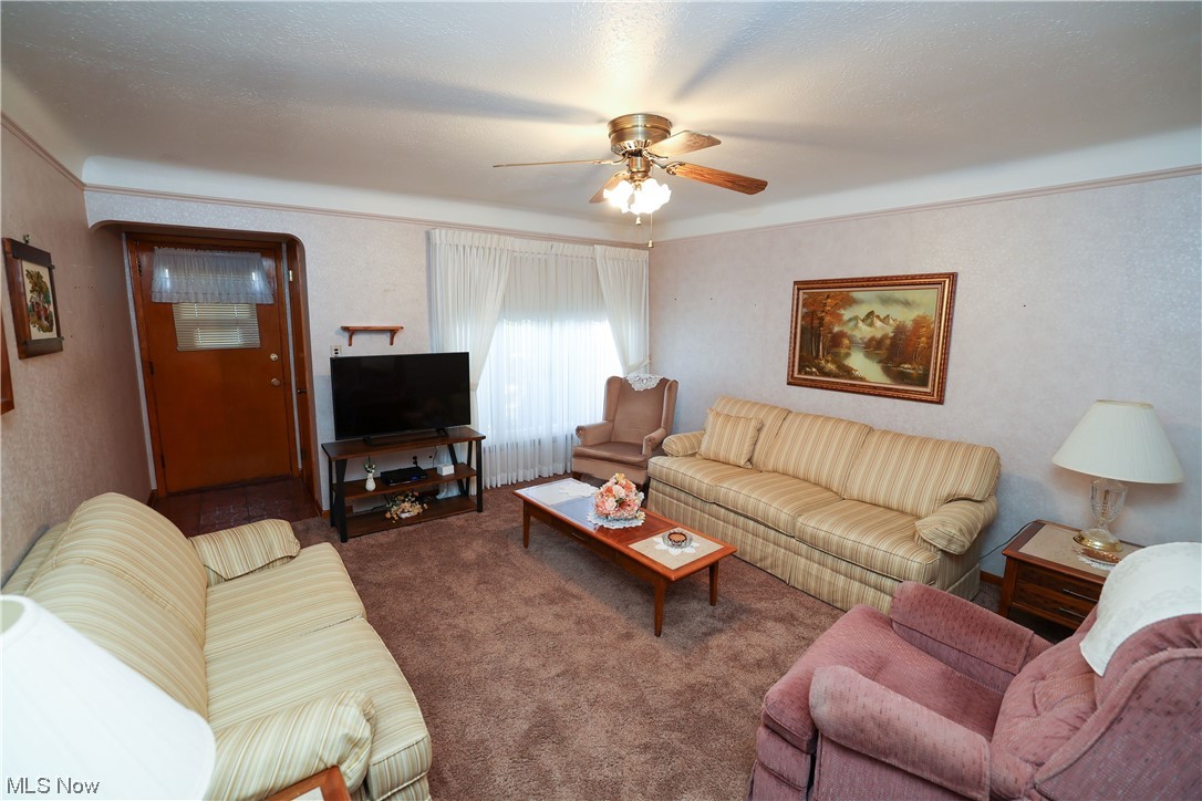 29252 Barjode Road Willowick, OH 44095 - Photo 2 of 21 Living room featuring dark carpet and ceiling fan