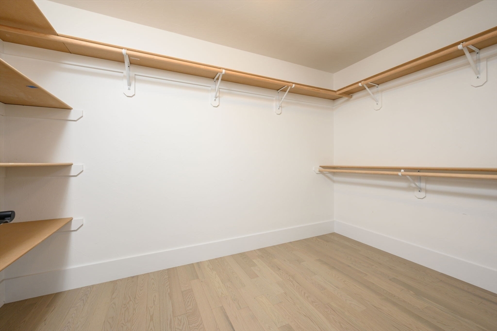 20 Howland Trail, Unit 35 Hanson, MA 02341 - Photo 7 of 26 a view of a room with racks on the wall