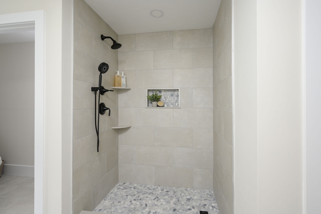 20 Howland Trail, Unit 35 Hanson, MA 02341 - Photo 9 of 26 a bathroom with a shower